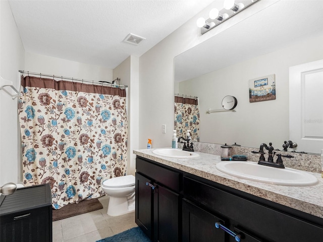 5946 81st Ave N, Pinellas Park, FL 33781 - bathroom featuring toilet, a sink, double vanity, and visible vents