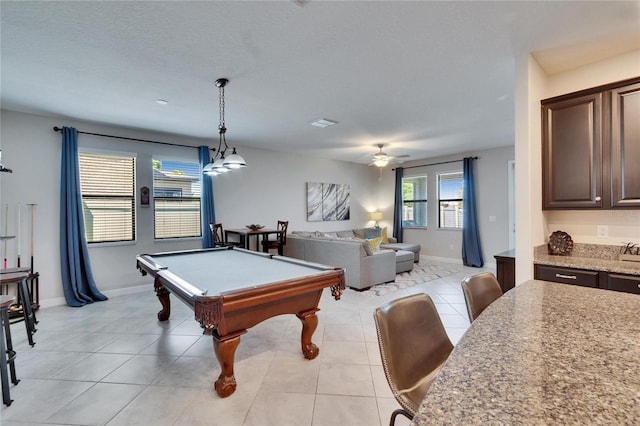 playroom with light tile patterned floors, a ceiling fan, baseboards, and pool table