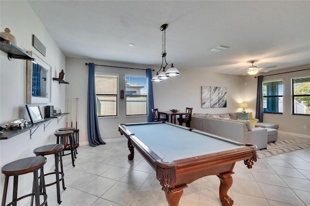 playroom with pool table, light tile patterned floors, baseboards, a ceiling fan, and a textured ceiling