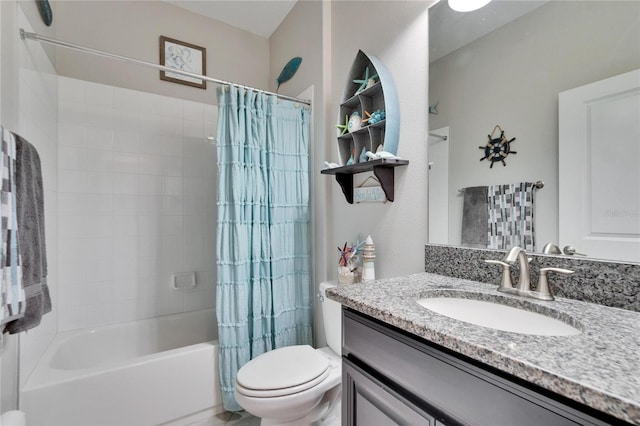 bathroom featuring shower / tub combo, vanity, and toilet