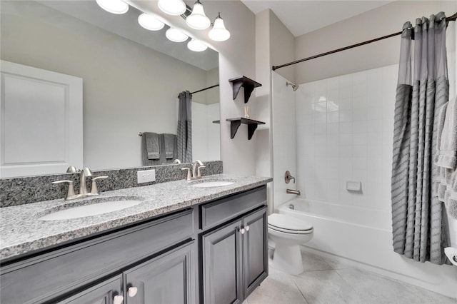 bathroom with shower / tub combo with curtain, tile patterned flooring, double vanity, and a sink
