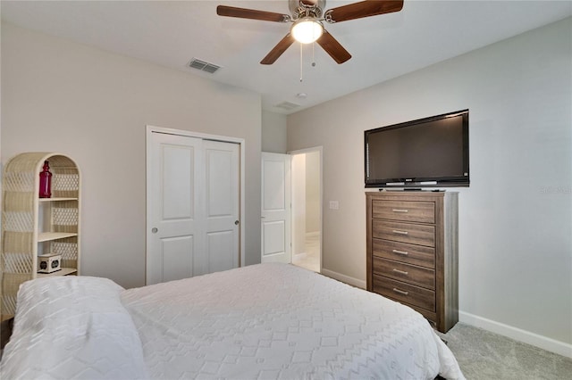 carpeted bedroom featuring visible vents, a closet, a ceiling fan, and baseboards