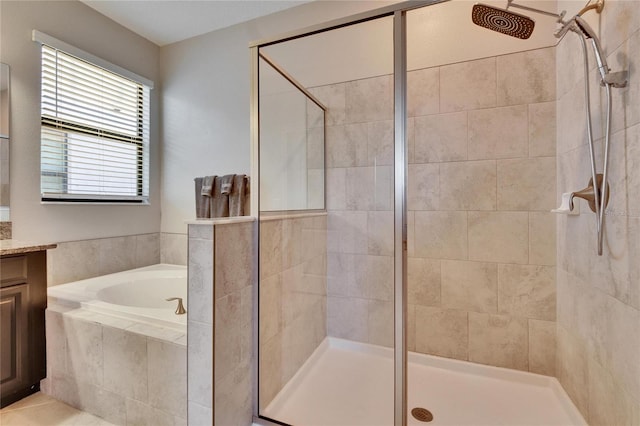 full bath with a garden tub, a stall shower, and vanity