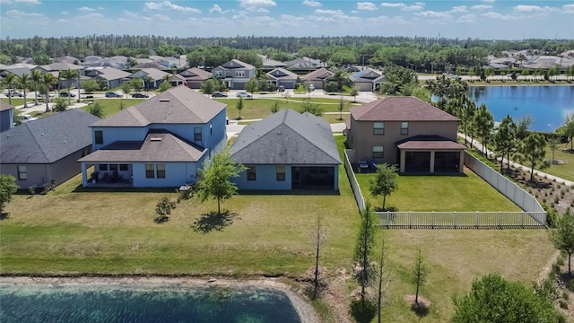 bird's eye view with a water view and a residential view