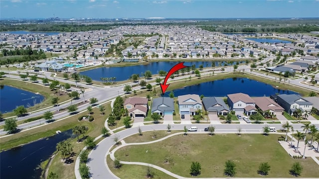 birds eye view of property featuring a residential view and a water view