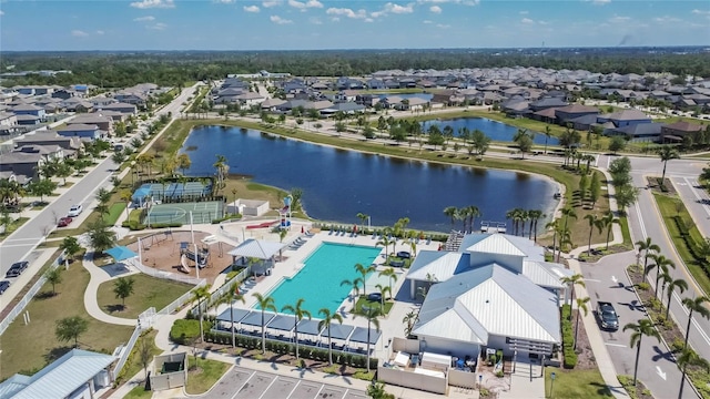 bird's eye view with a residential view and a water view