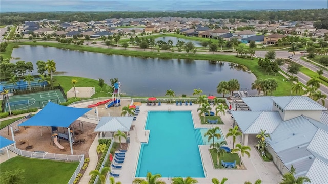 aerial view with a water view and a residential view