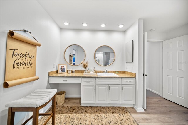 1810 Pine Hill Dr, Safety Harbor, FL 34695 - bathroom featuring wood finished floors, vanity, and recessed lighting