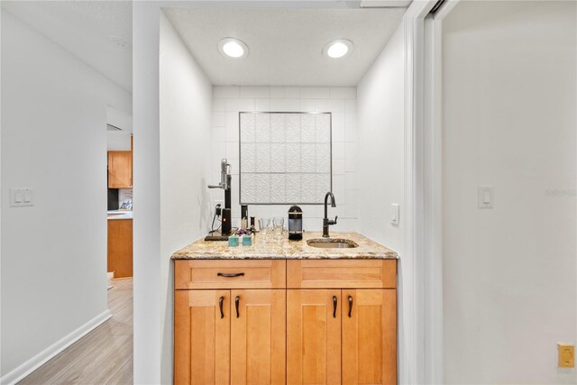 1810 Pine Hill Dr, Safety Harbor, FL 34695 - indoor wet bar with light wood-style floors and baseboards