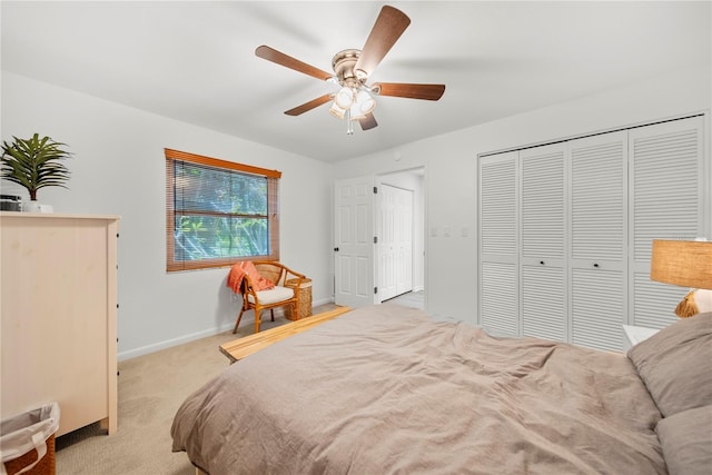 1810 Pine Hill Dr, Safety Harbor, FL 34695 - bedroom featuring carpet floors, baseboards, ceiling fan, and a closet