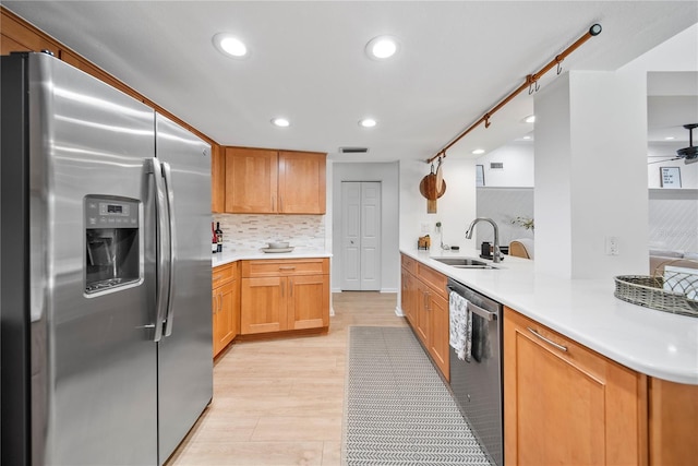 1810 Pine Hill Dr, Safety Harbor, FL 34695 - kitchen with stainless steel appliances, a sink, recessed lighting, backsplash, and light countertops