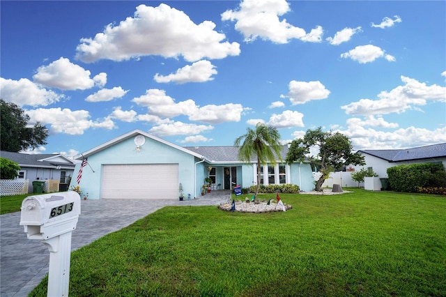 ranch-style house with stucco siding, decorative driveway, a garage, and fence