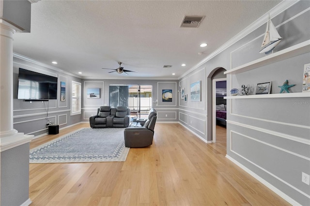 2510 Cross More St, Valrico, FL 33594 - living area featuring a ceiling fan, decorative columns, ornamental molding, and a decorative wall