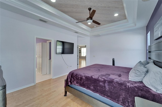 2510 Cross More St, Valrico, FL 33594 - bedroom with visible vents, crown molding, a raised ceiling, baseboards, and light wood-style flooring