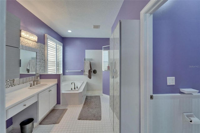 2510 Cross More St, Valrico, FL 33594 - bathroom with a garden tub, a stall shower, visible vents, and vanity