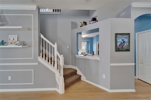 2510 Cross More St, Valrico, FL 33594 - stairs featuring baseboards, ornamental molding, and wood finished floors