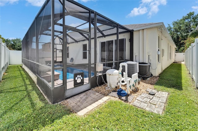 2510 Cross More St, Valrico, FL 33594 - back of house with a lanai, a lawn, a fenced in pool, a fenced backyard, and a patio