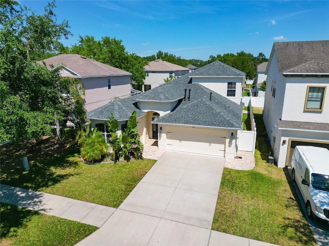 2510 Cross More St, Valrico, FL 33594 - view of front of house featuring a front yard, a residential view, a garage, a shingled roof, and stucco siding