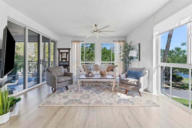 sunroom / solarium featuring wood finished floors