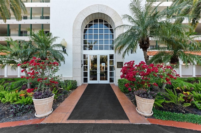4750 Dolphin Cay Ln S Unit 209, Saint Petersburg, FL 33711 - doorway to property with french doors and stucco siding