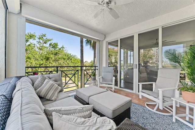 4750 Dolphin Cay Ln S Unit 209, Saint Petersburg, FL 33711 - sunroom with ceiling fan and an outdoor hangout area