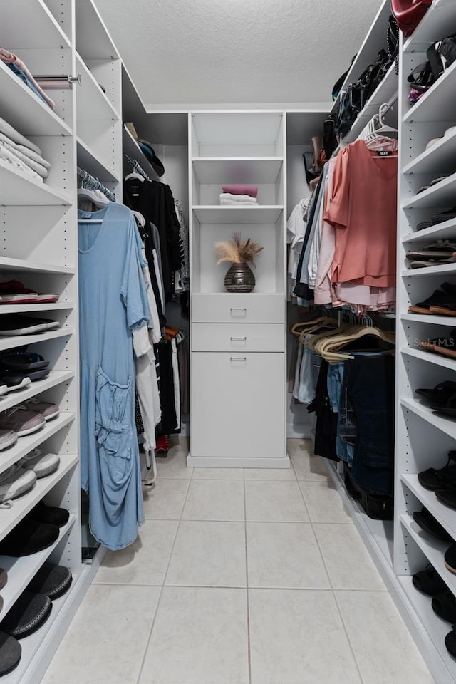 4750 Dolphin Cay Ln S Unit 209, Saint Petersburg, FL 33711 - walk in closet with tile patterned floors