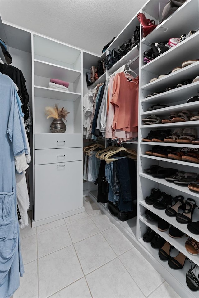 4750 Dolphin Cay Ln S Unit 209, Saint Petersburg, FL 33711 - spacious closet featuring light tile patterned floors