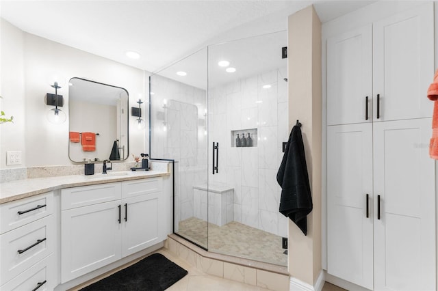 4750 Dolphin Cay Ln S Unit 209, Saint Petersburg, FL 33711 - bathroom with vanity, a stall shower, recessed lighting, a closet, and tile patterned flooring