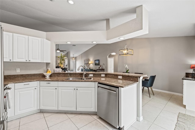 kitchen featuring light tile patterned floors, dishwasher, white cabinets, and a sink