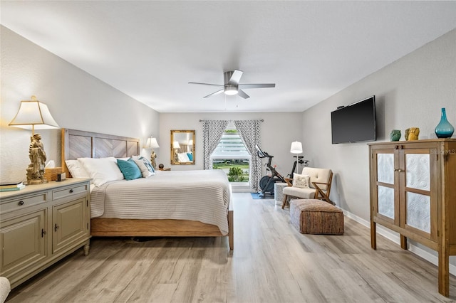 bedroom featuring baseboards, a ceiling fan, and light wood-style floors