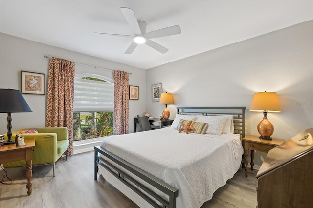 bedroom with wood finished floors and a ceiling fan