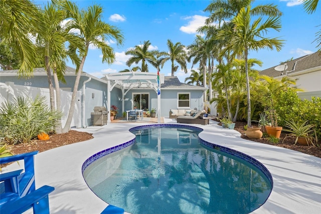 view of pool with a fenced in pool, a patio area, outdoor lounge area, grilling area, and a pergola