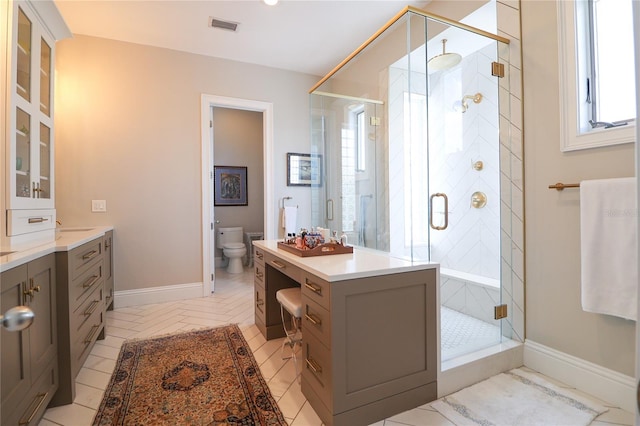 11105 5th St E, Treasure Island, FL 33706 - full bathroom featuring toilet, a stall shower, baseboards, visible vents, and vanity