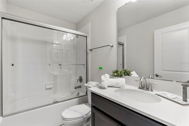 1568 Maidstone Ct, Davenport, FL 33896 - full bathroom featuring vanity, shower / bath combination with glass door, and a textured wall