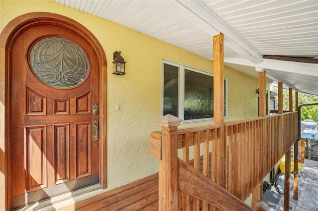 doorway to property with stucco siding
