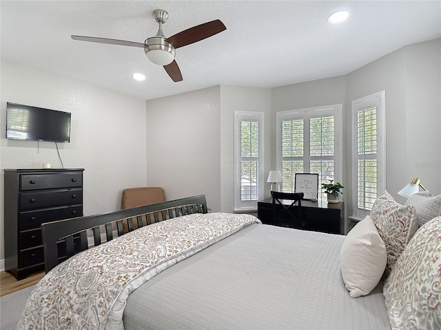 bedroom featuring recessed lighting, ceiling fan, and wood finished floors