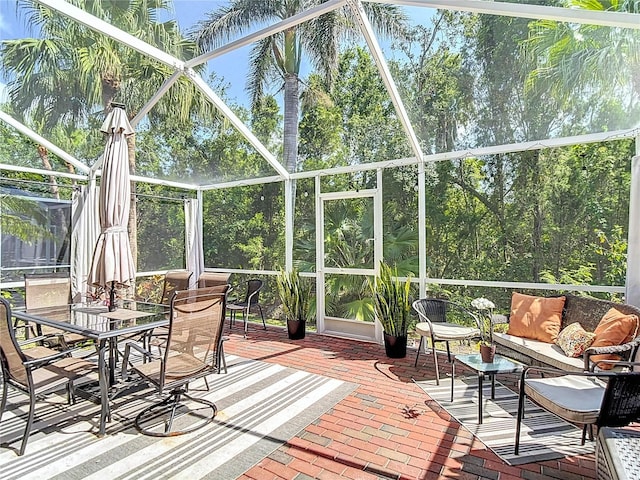 sunroom featuring an outdoor hangout area