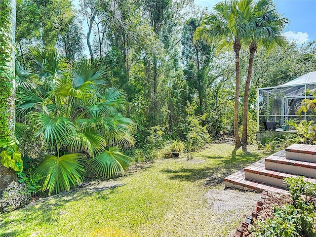 view of yard featuring a lanai