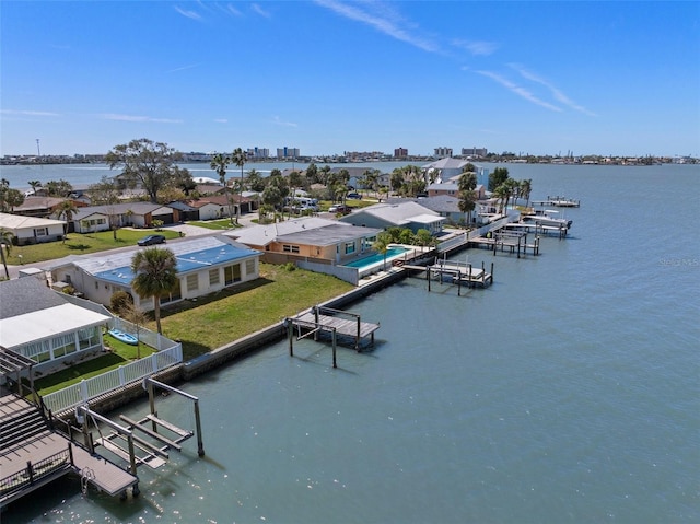 birds eye view of property with a water view and a residential view
