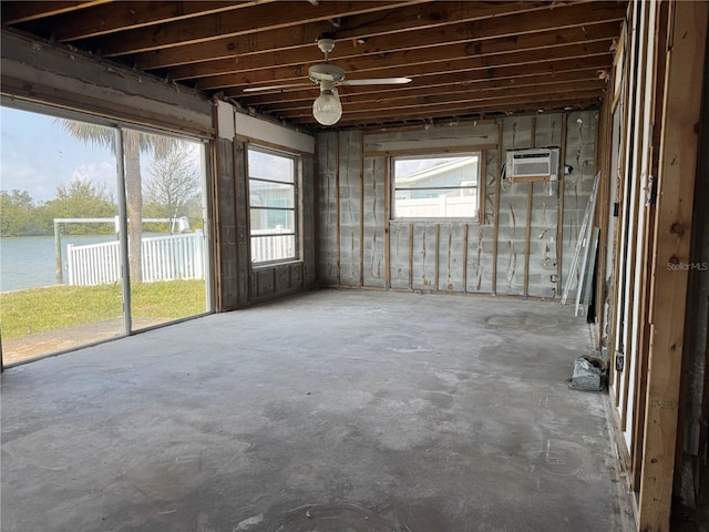 misc room with a water view and an AC wall unit