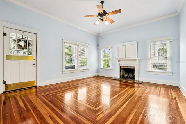 515 Frank Lloyd Wright Way, Lakeland, FL 33803 - unfurnished living room with a high end fireplace, a ceiling fan, wood-type flooring, baseboards, and crown molding