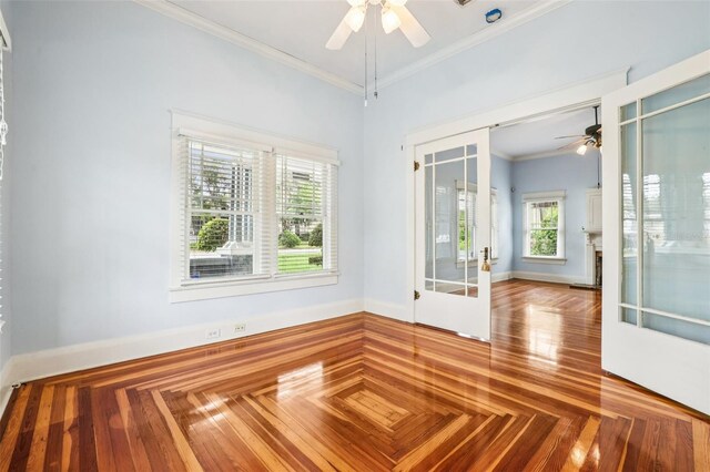 515 Frank Lloyd Wright Way, Lakeland, FL 33803 - empty room with ceiling fan, crown molding, french doors, and a fireplace with raised hearth