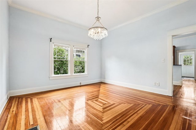 515 Frank Lloyd Wright Way, Lakeland, FL 33803 - unfurnished room featuring a chandelier, ornamental molding, and baseboards
