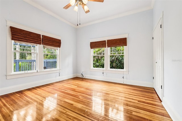 515 Frank Lloyd Wright Way, Lakeland, FL 33803 - spare room featuring ornamental molding, hardwood / wood-style flooring, ceiling fan, and baseboards