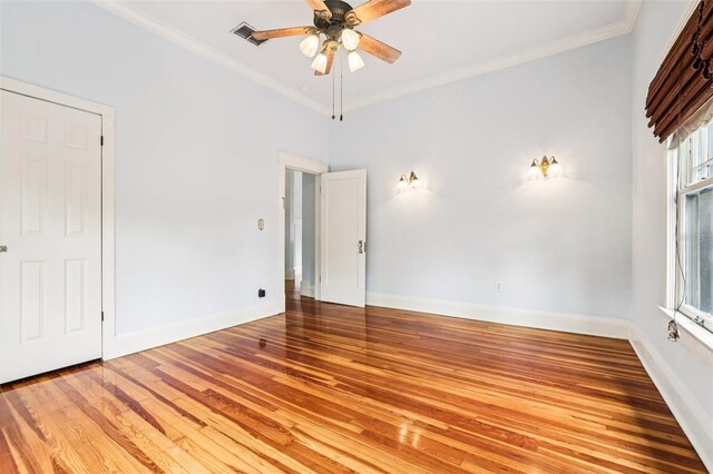 515 Frank Lloyd Wright Way, Lakeland, FL 33803 - unfurnished bedroom featuring wood finished floors, ornamental molding, baseboards, and a ceiling fan