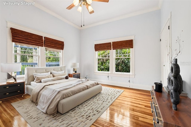 515 Frank Lloyd Wright Way, Lakeland, FL 33803 - bedroom featuring wood finished floors, ornamental molding, and ceiling fan