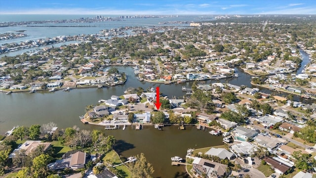 drone / aerial view featuring a water view and a residential view