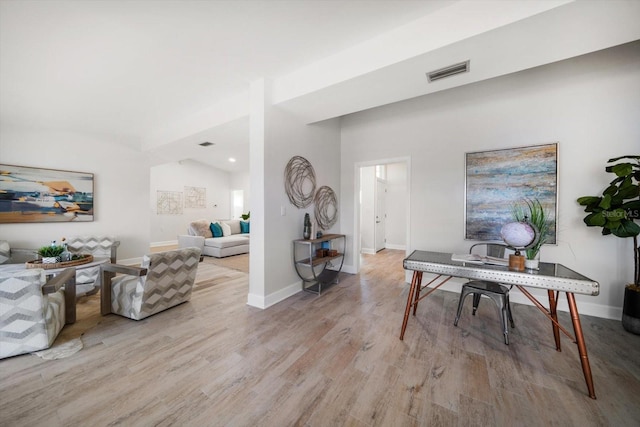 office with light wood finished floors, baseboards, and visible vents