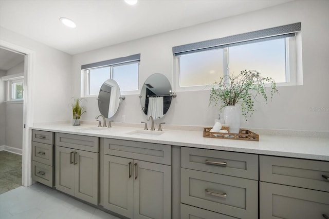 bathroom featuring recessed lighting and vanity