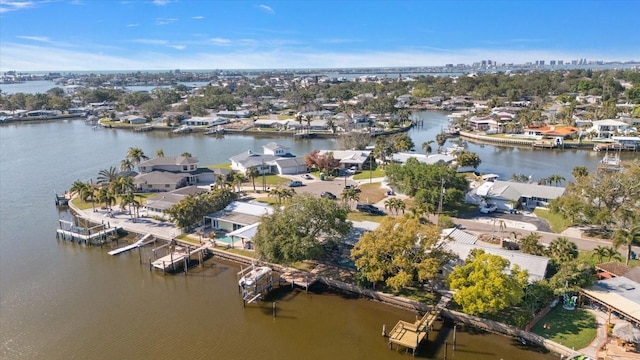 birds eye view of property featuring a residential view and a water view